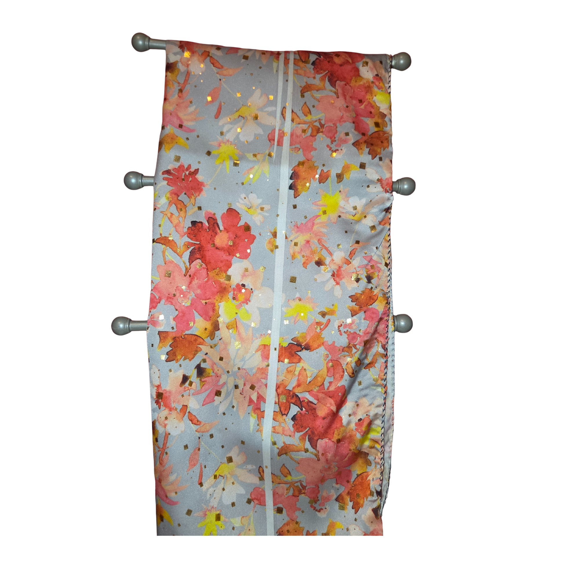 Floral patterned shower curtain with metal hooks on a white background