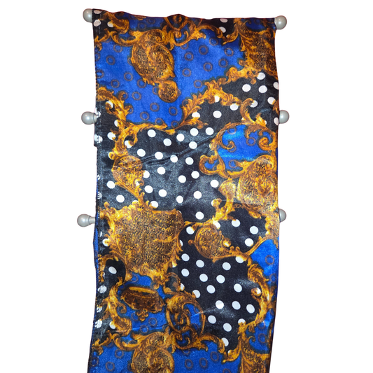 Decorative headband with blue, gold, and black pattern on a white background