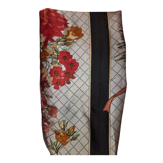 Floral-patterned fabric with a black strip on a white background