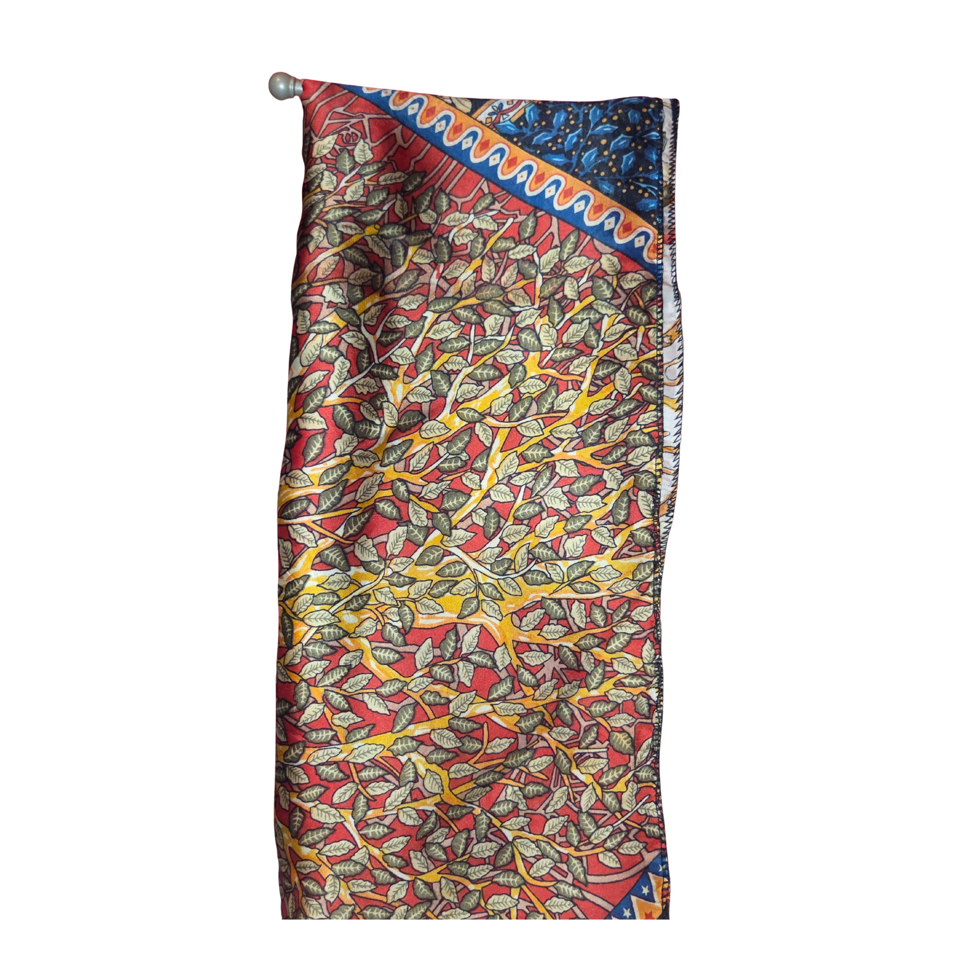 Colorful patterned fabric with a decorative border on a white background