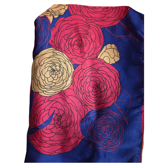 Silk scarf with floral design on a blue background