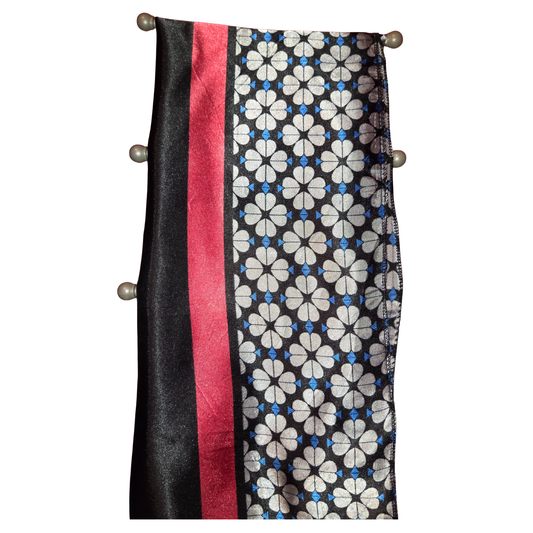 Scarf with black, red, and floral pattern on a white background