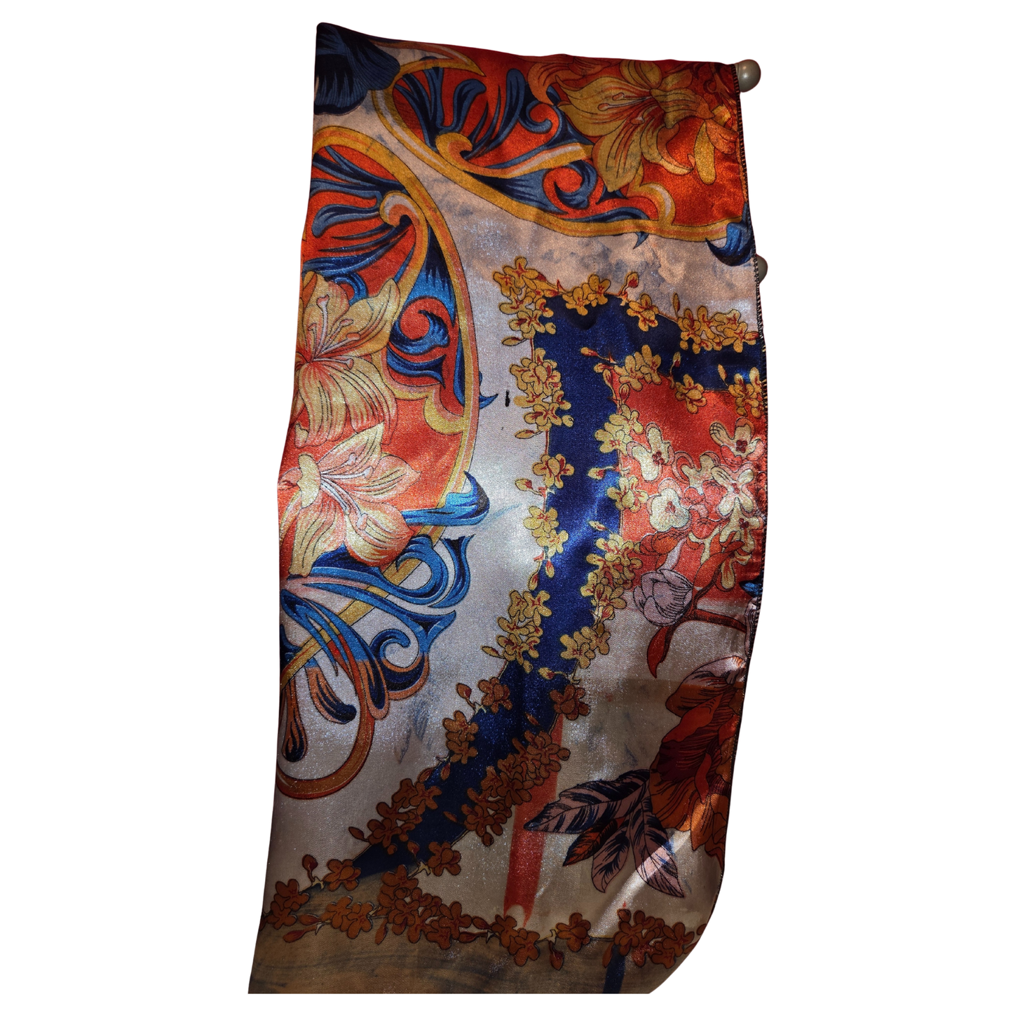 Decorative scarf with floral and paisley patterns on a white background