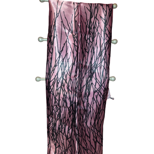 Pink scarf with black abstract pattern on a white background
